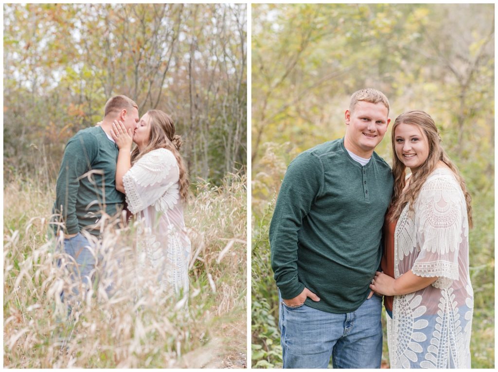 couple posing outside in a field for engagement photos