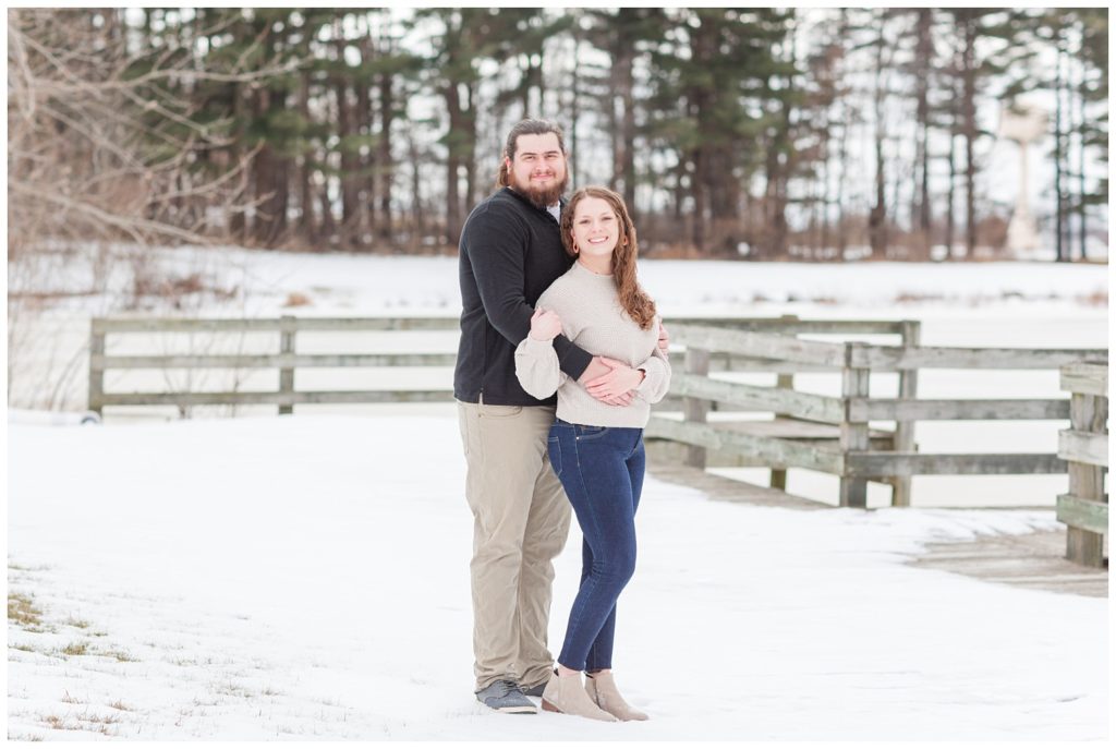 couple doing prom pose during ohio engagement session in snow
