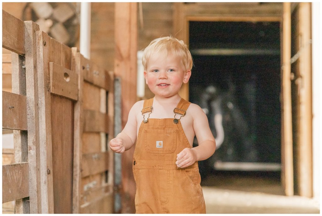 boy posing for photos in his family's barn in Ohio