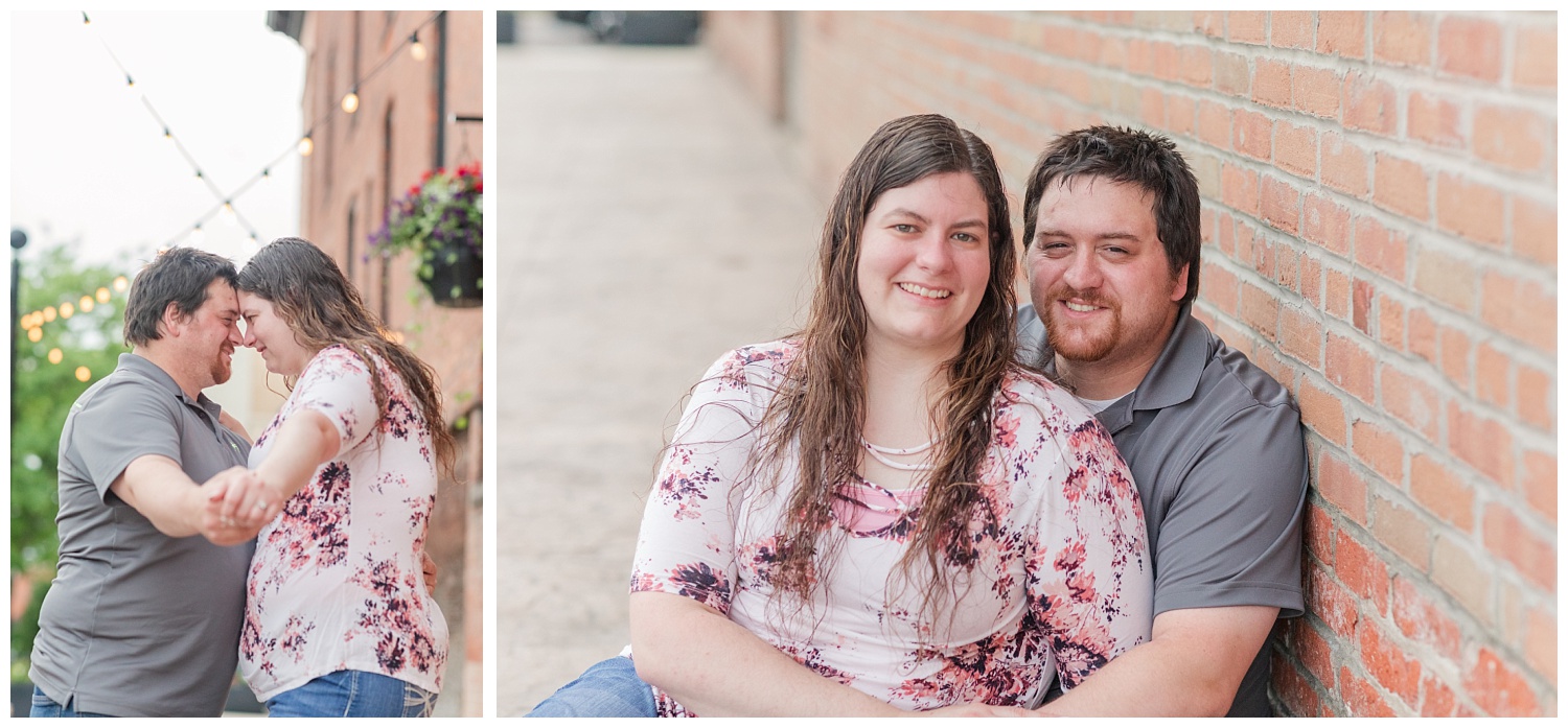 couple posing for engagement photos in downtown Tiffin