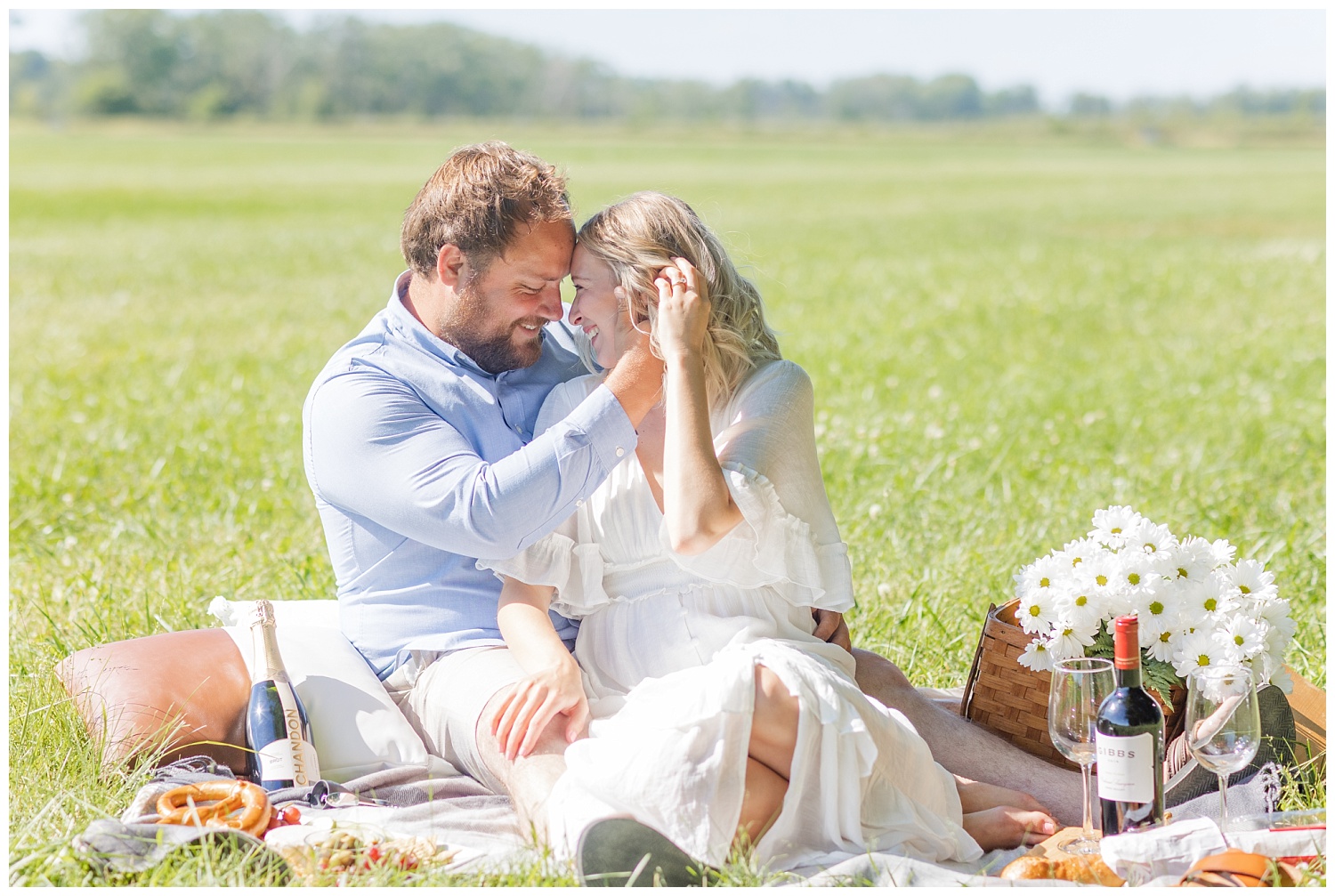 couple touching foreheads in a field in Ohio