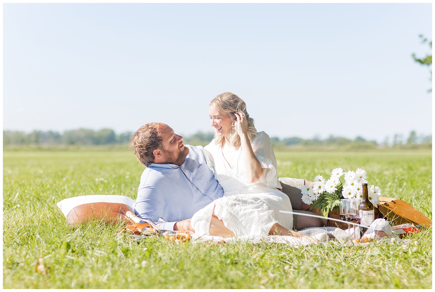 couple sitting together in a field in Ohio