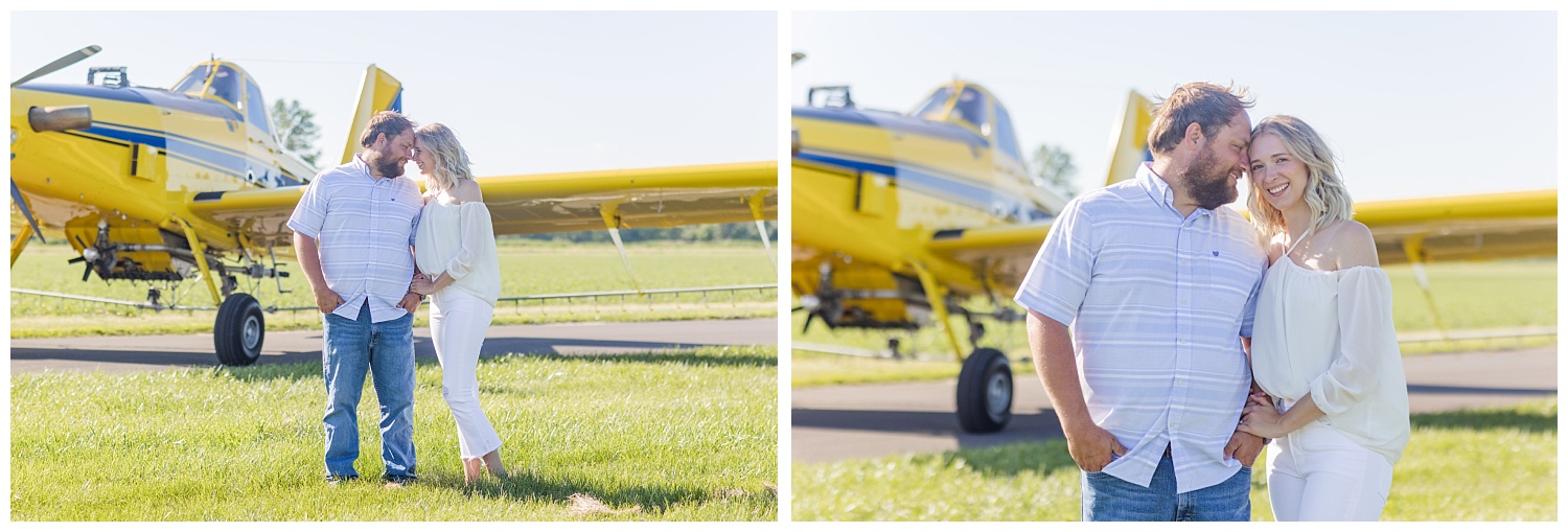 couple posing together for engagement session with airplane