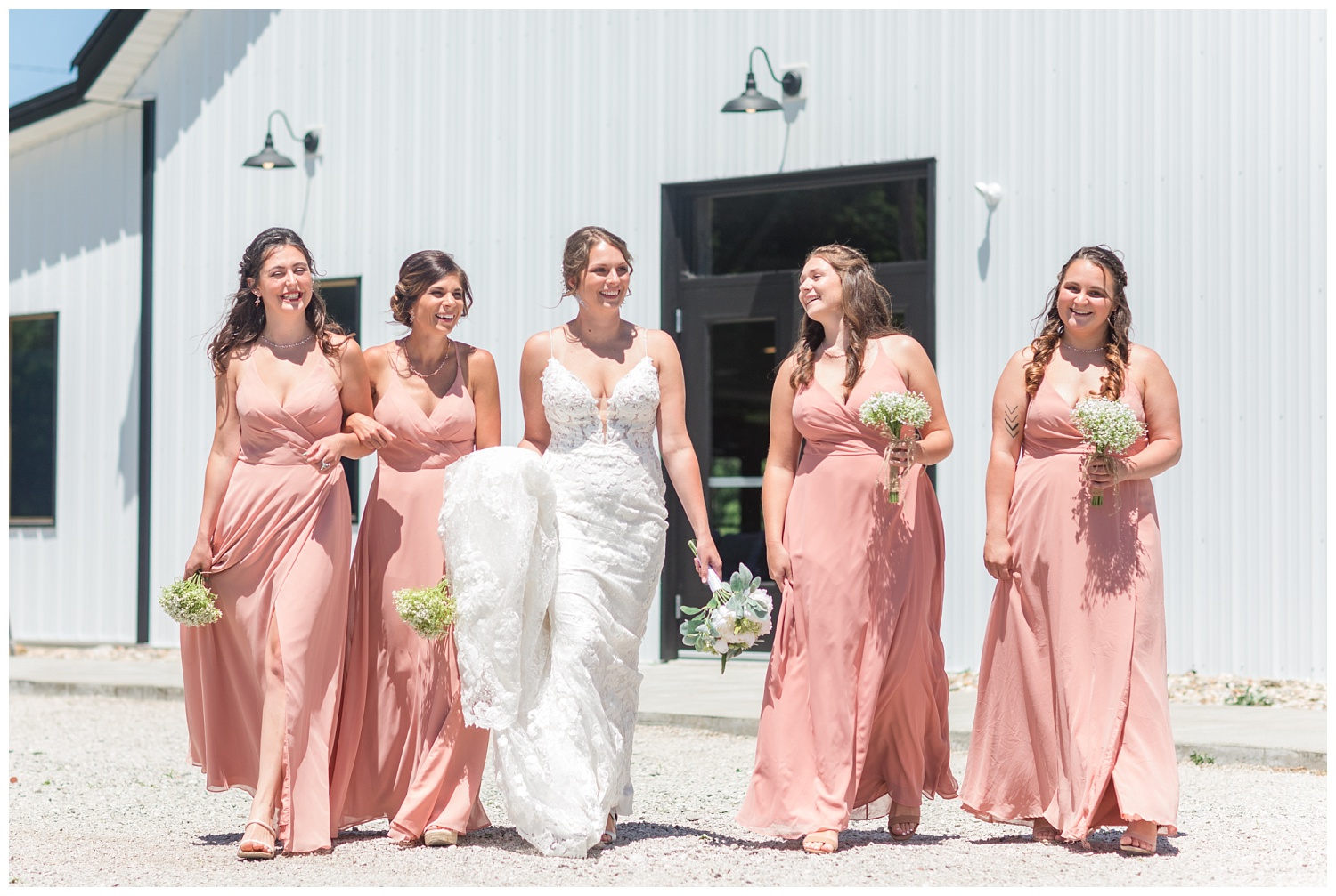 bridal party walking together outside
