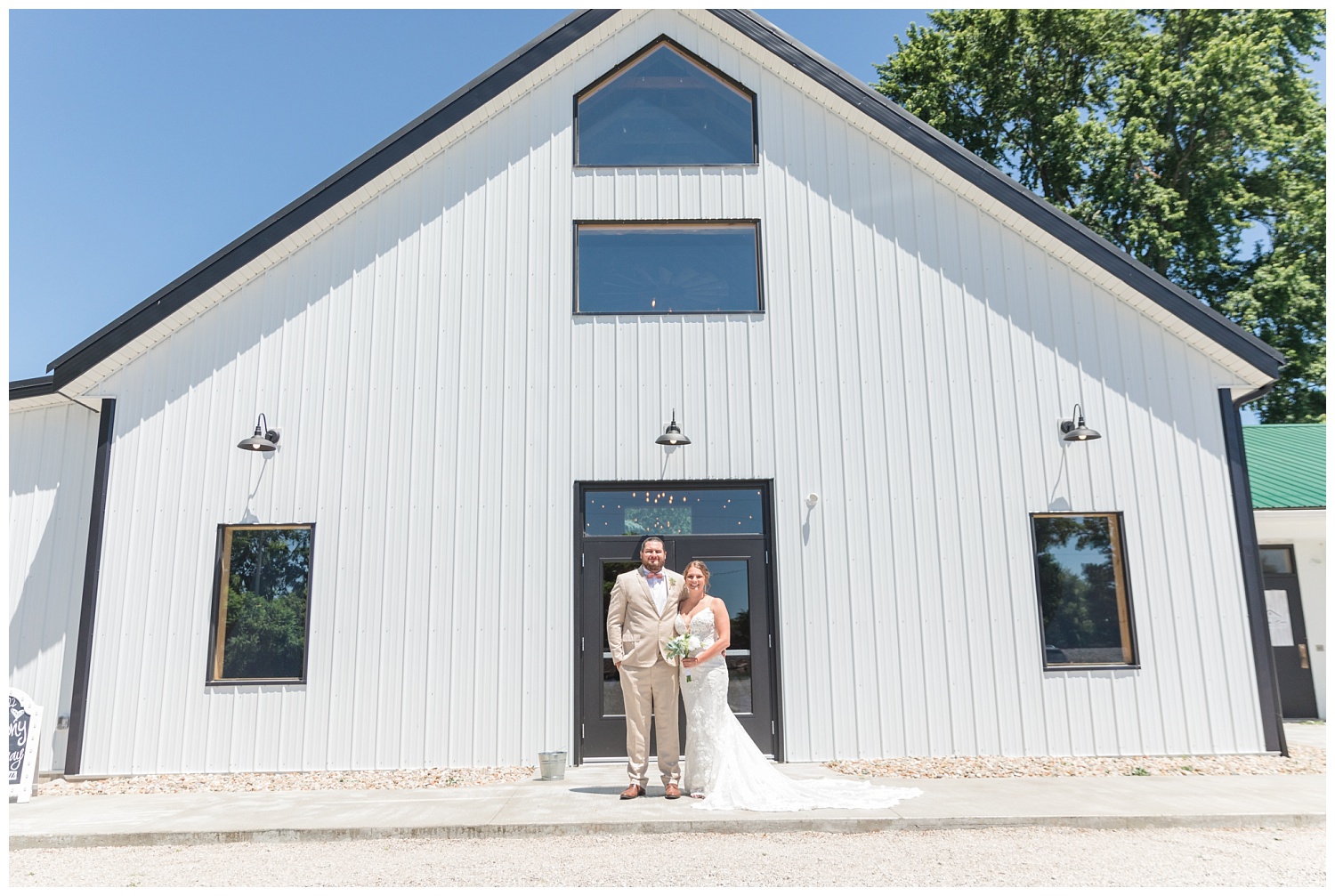 bride and groom posing outside at the Village Barn in Ohio
