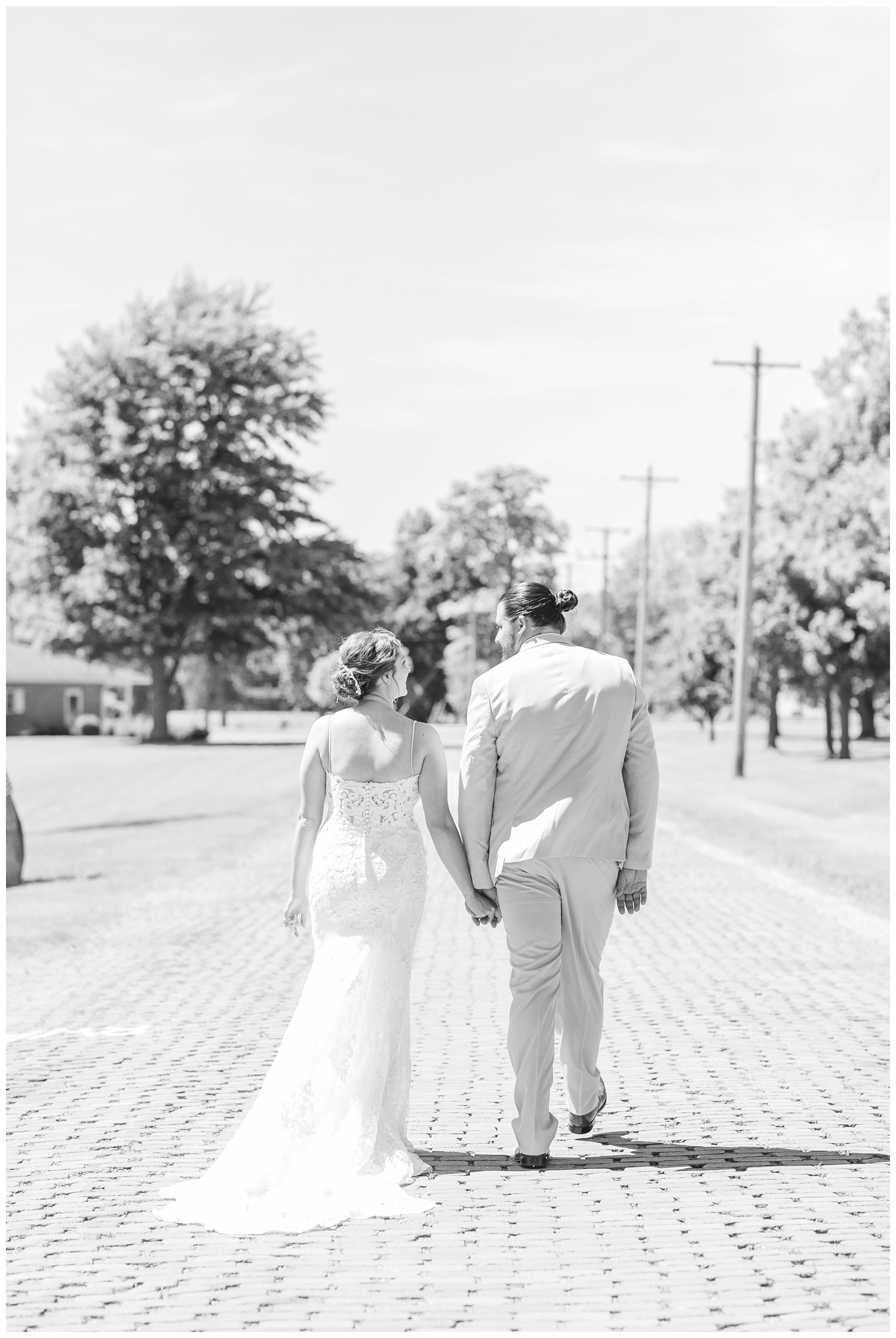 bride and groom walking away together in Ohio