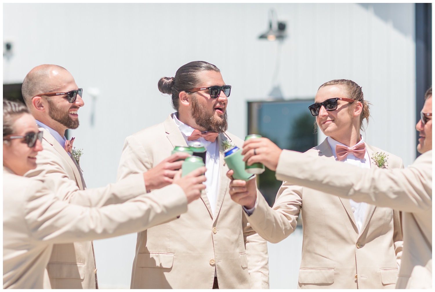 groomsmen toasting and wearing sunglasses
