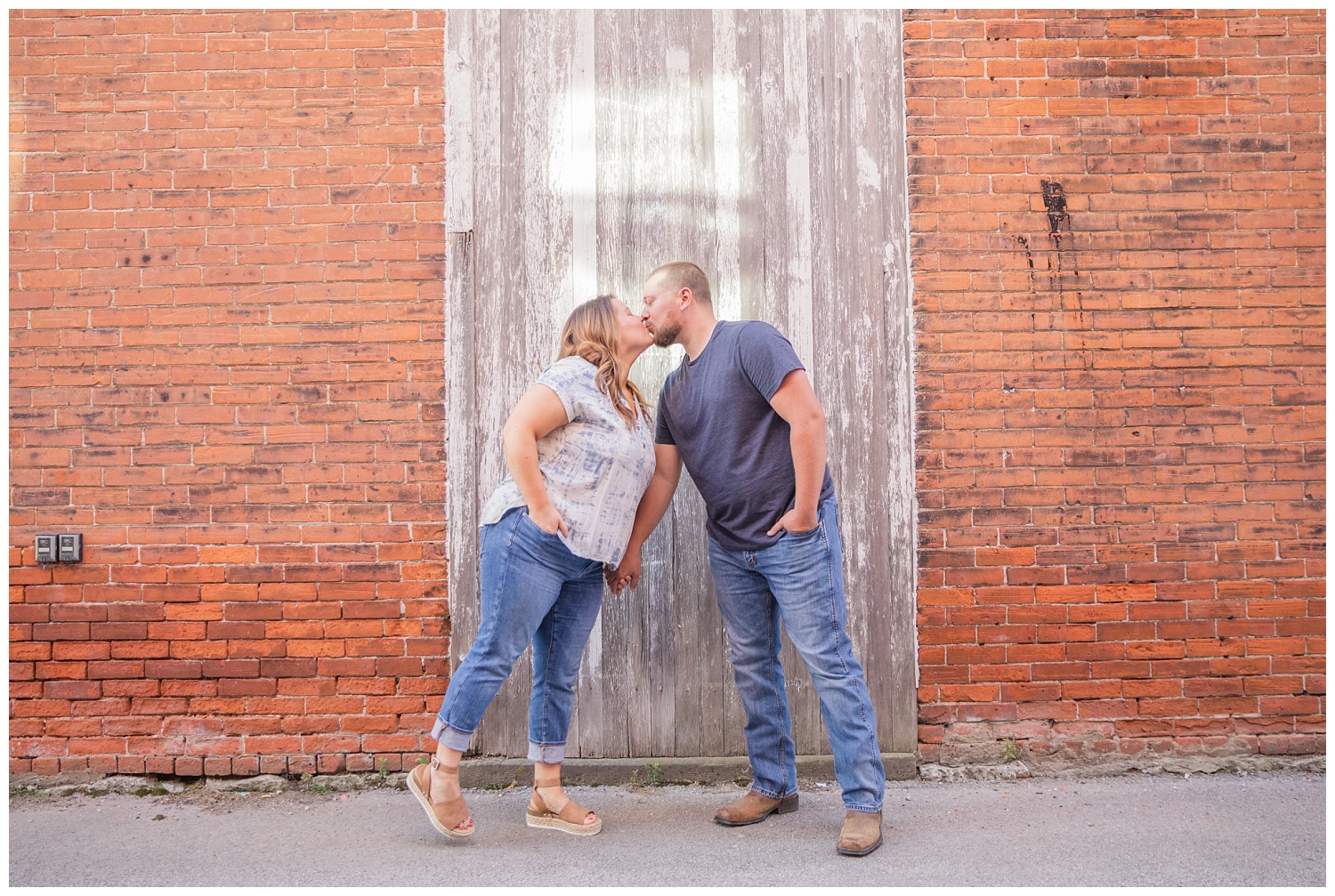 engaged couple leaning in for a kiss in Ohio