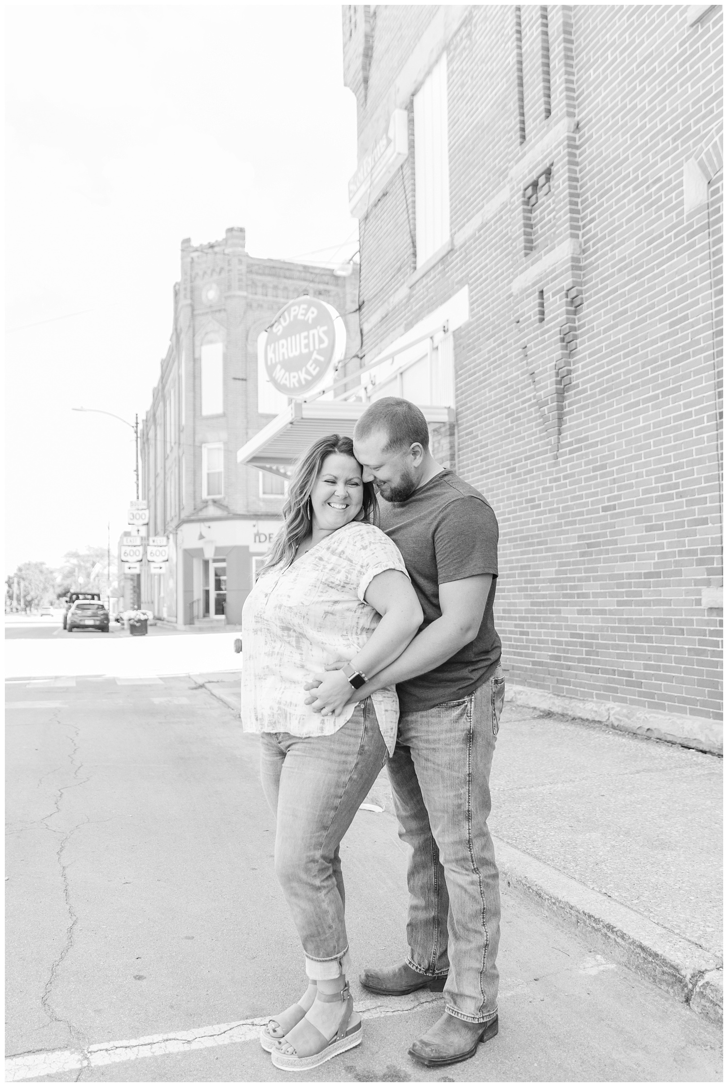 couple laughing in front of the Kirwen's market in Gibsonburg, Ohio