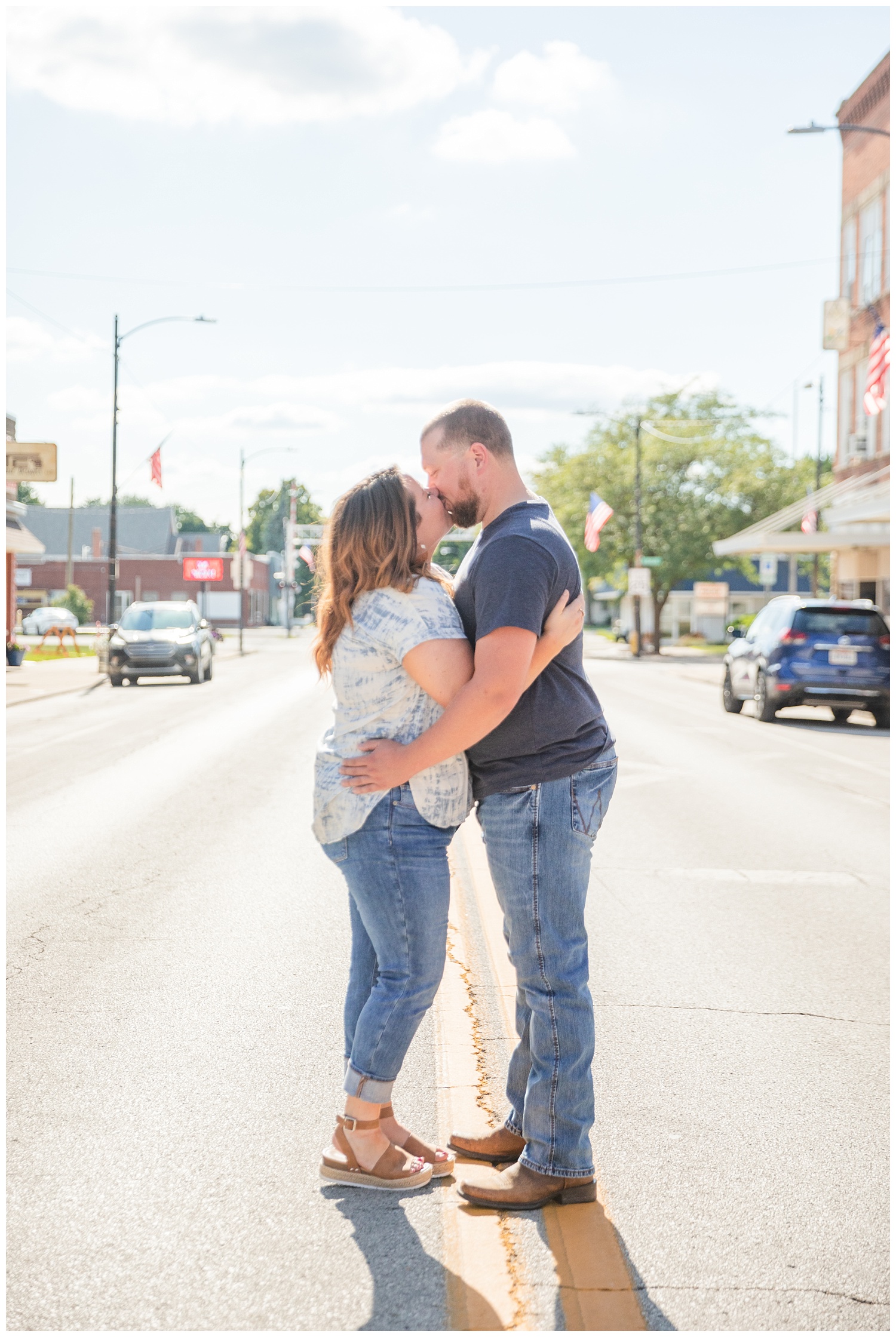 couple kissing in the middle of the road for engagement photos in Ohio