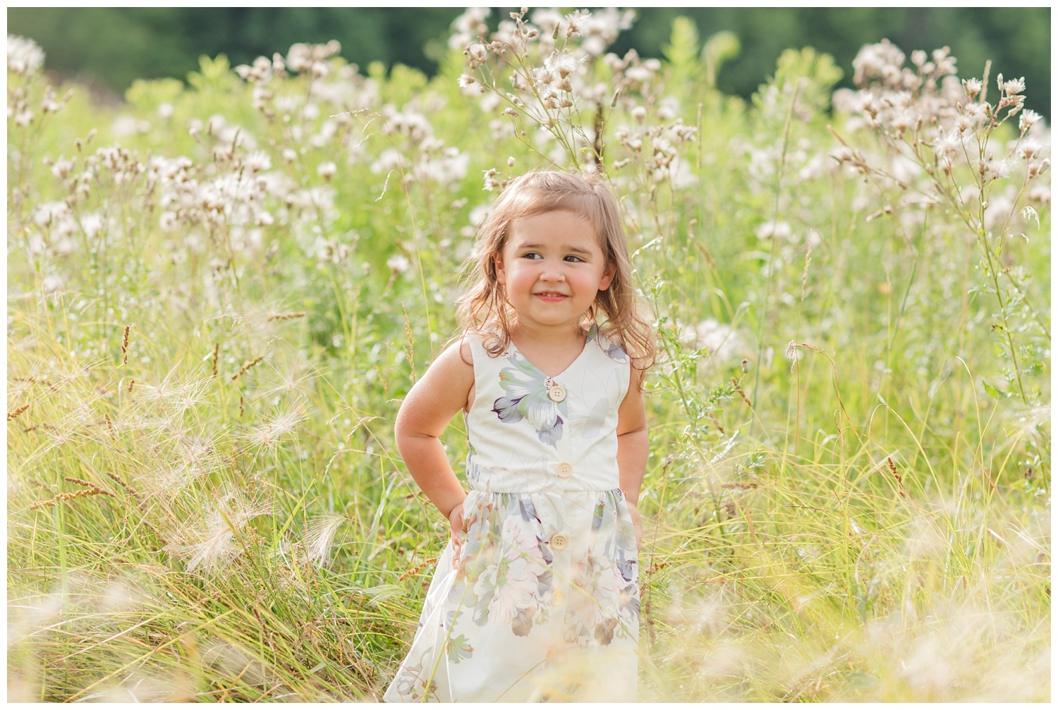 little girl standing in grass in Ohio