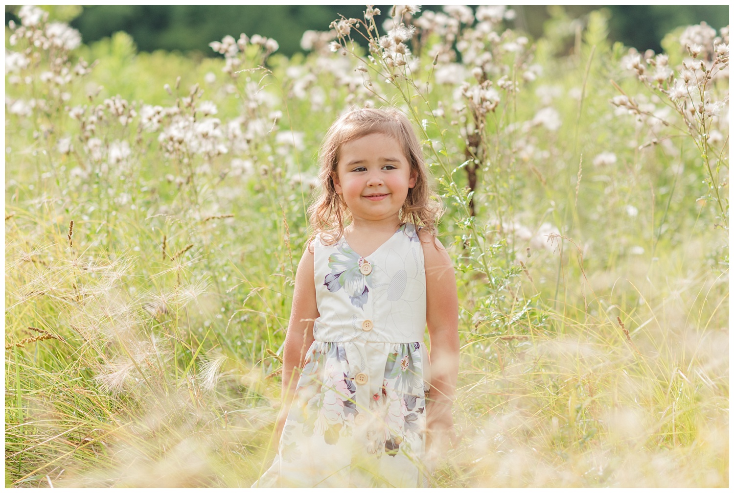 little girl standing in a wheat field in Ohio