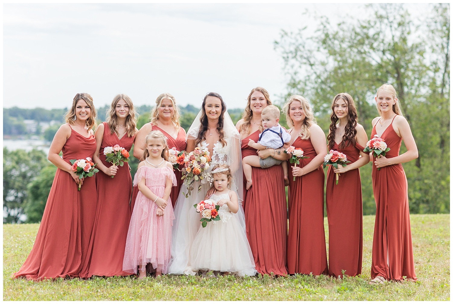 bridal party posing next to the lake in Ohio