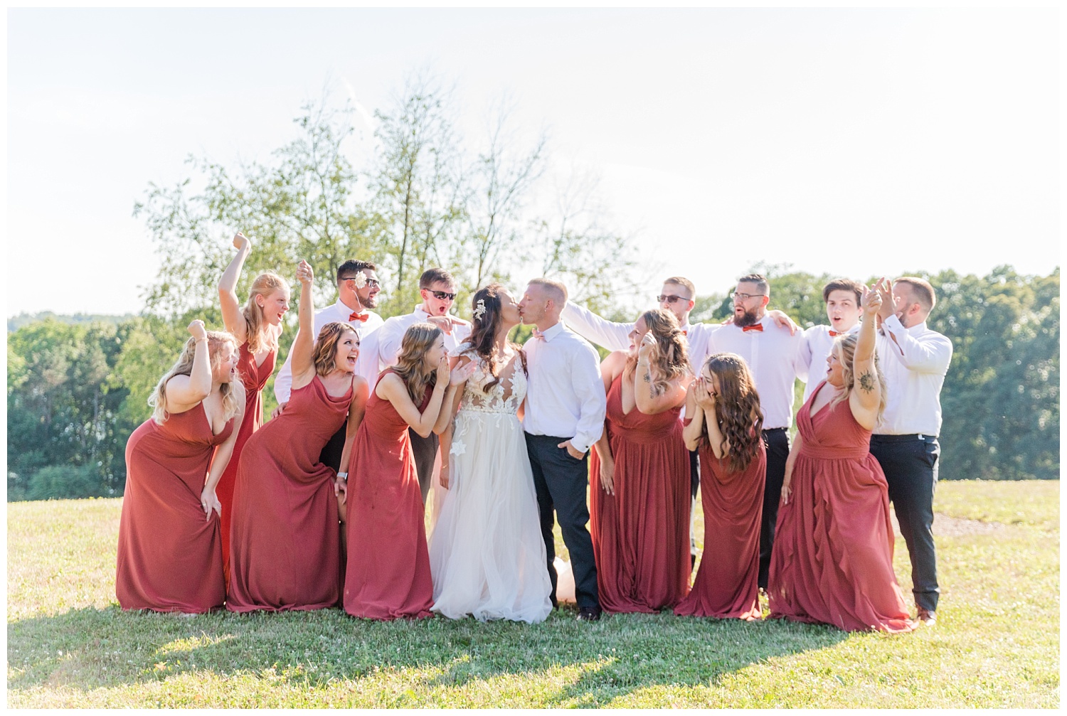 full bridal party cheering at wedding at Apple Valley Lake