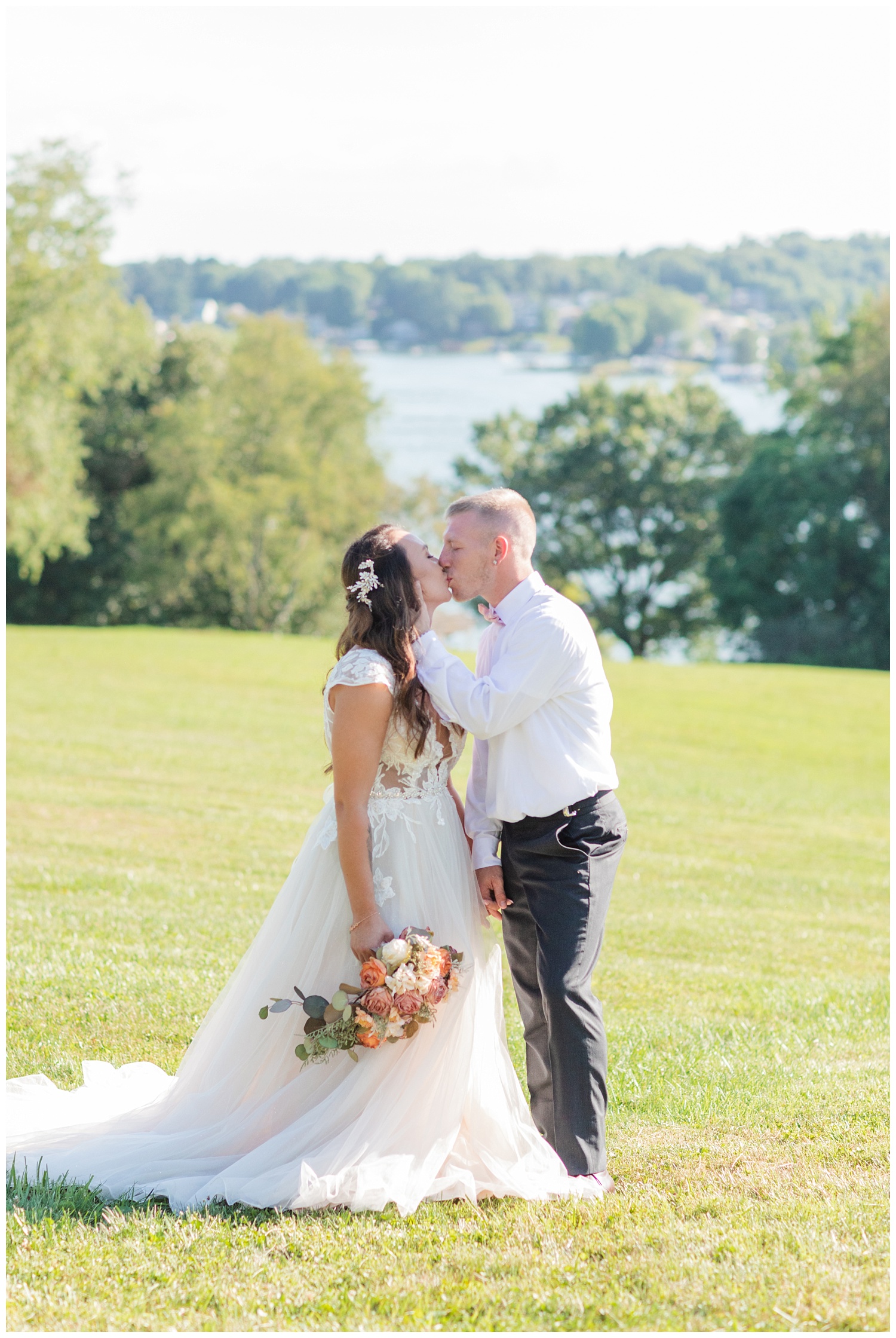 groom kissing the bride at Apple Valley Lake wedding
