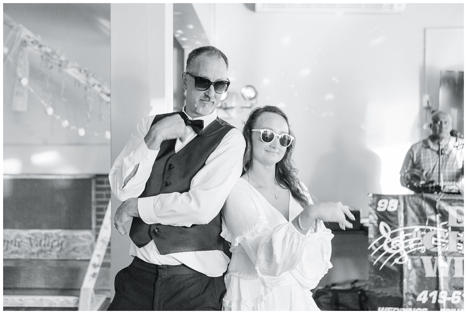 bride and her dad doing a choreographed dance at wedding with sunglasses