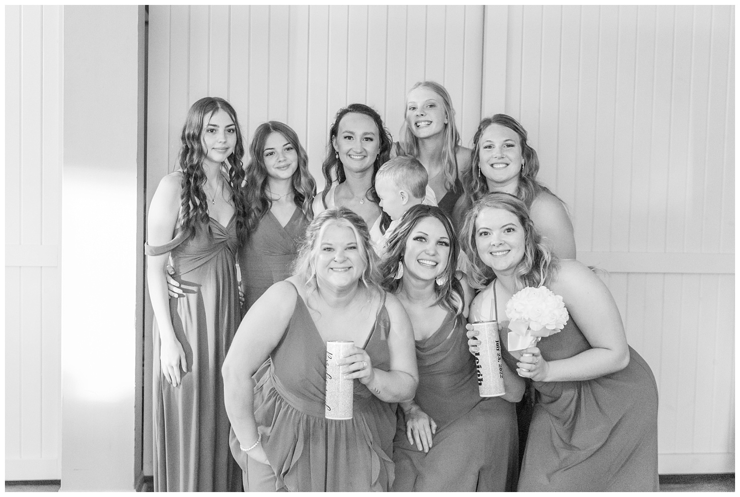 bride and bridesmaids posing together at reception