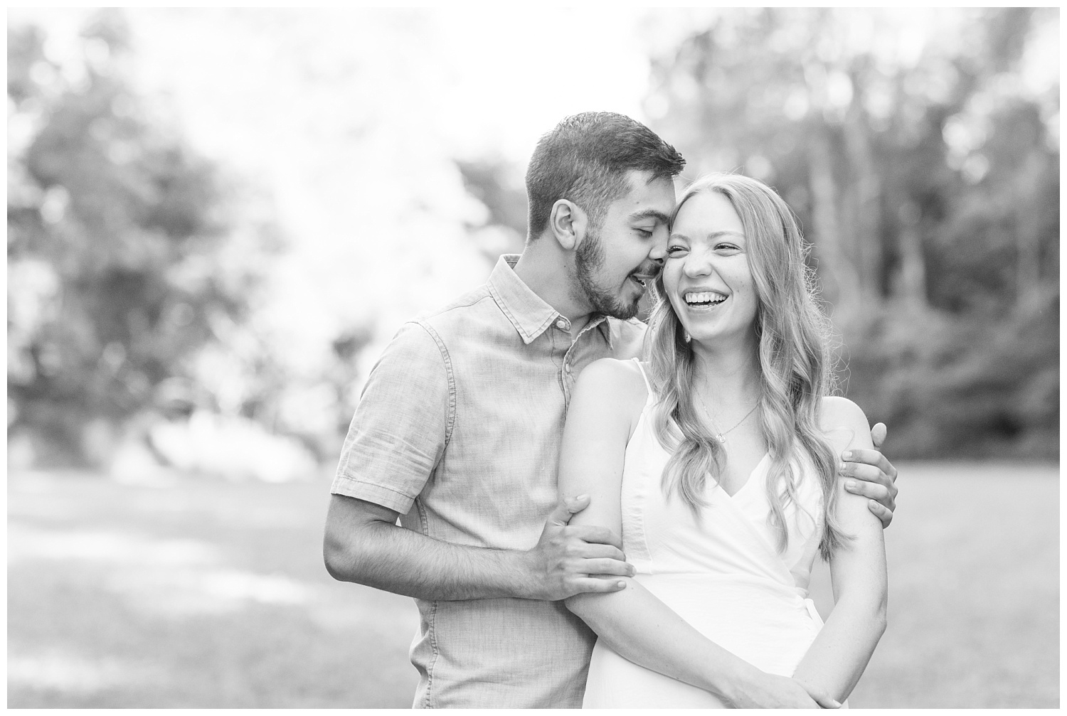couple laughing at engagement session in Green Springs