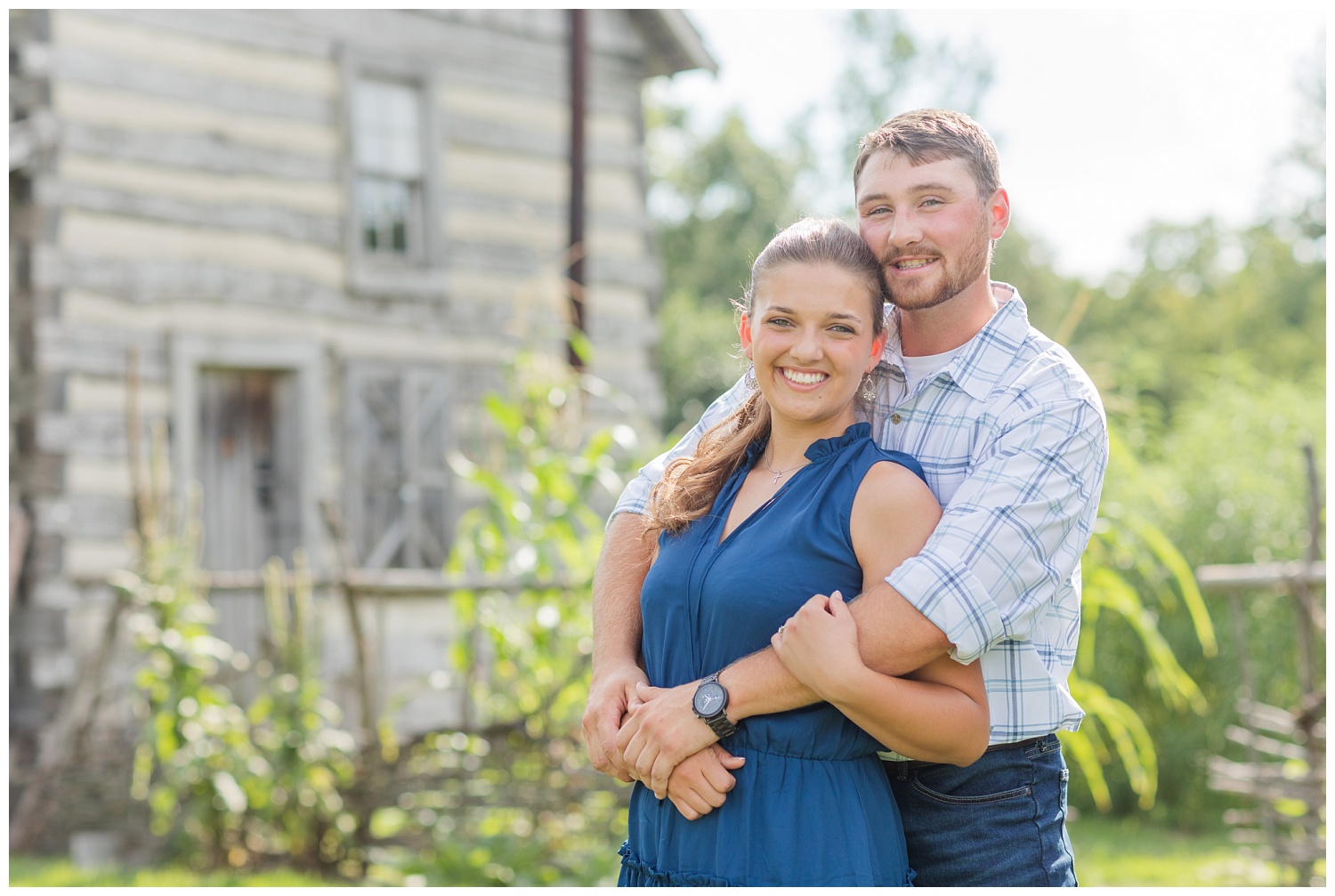 couple standing in front of a cabin during Gibsonburg engagement session