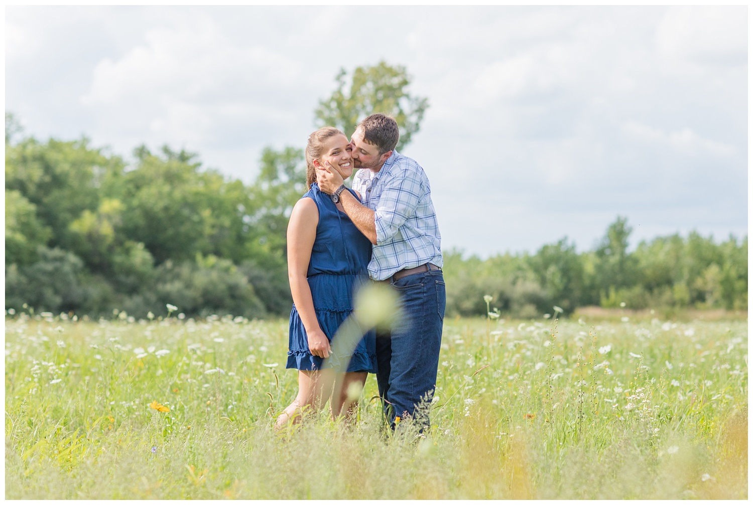 couple kissing in a flower field in Gibsonburg Ohio