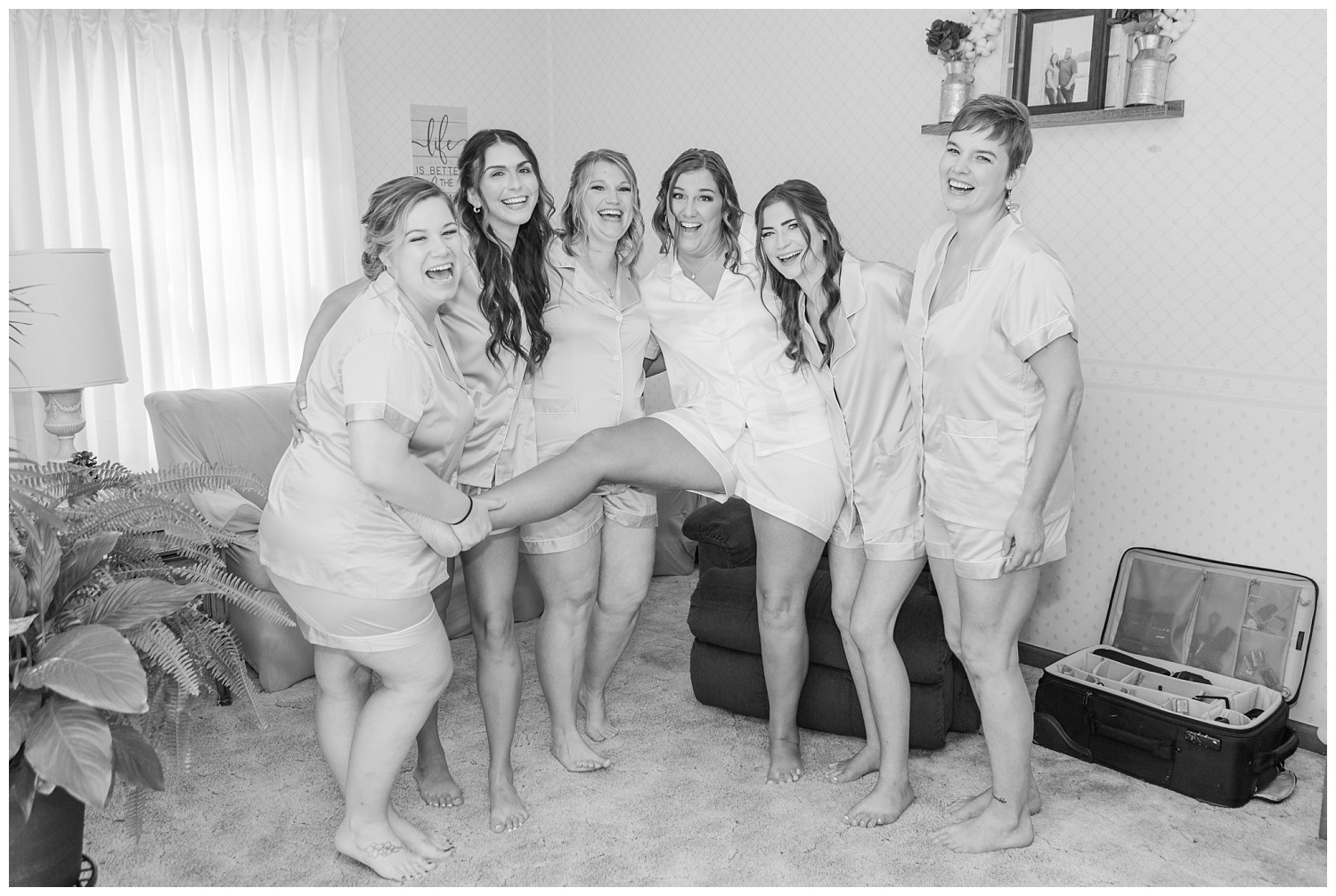 bridesmaids posing while getting ready