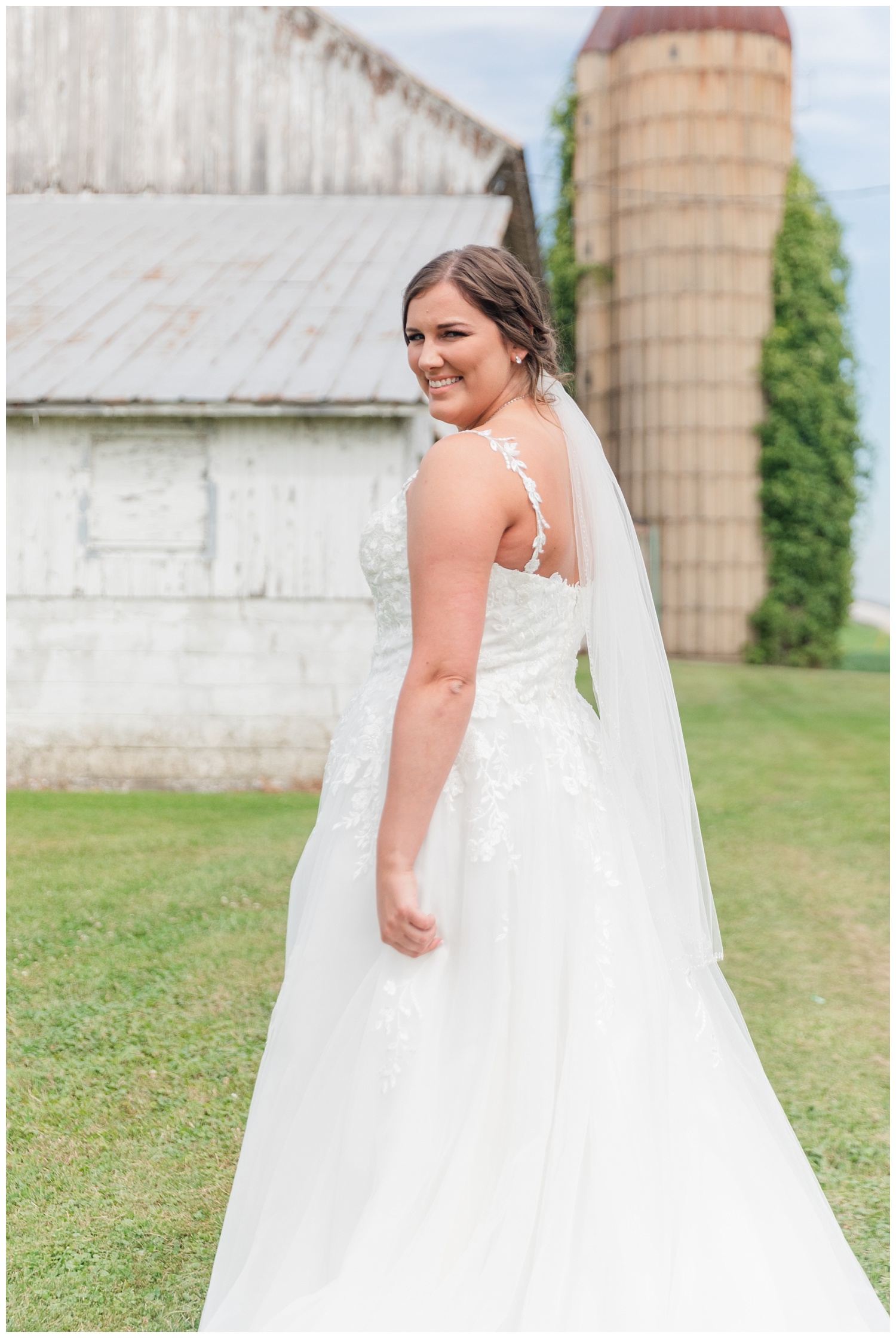 bride posing at her farm for photos in Fremont, Ohio