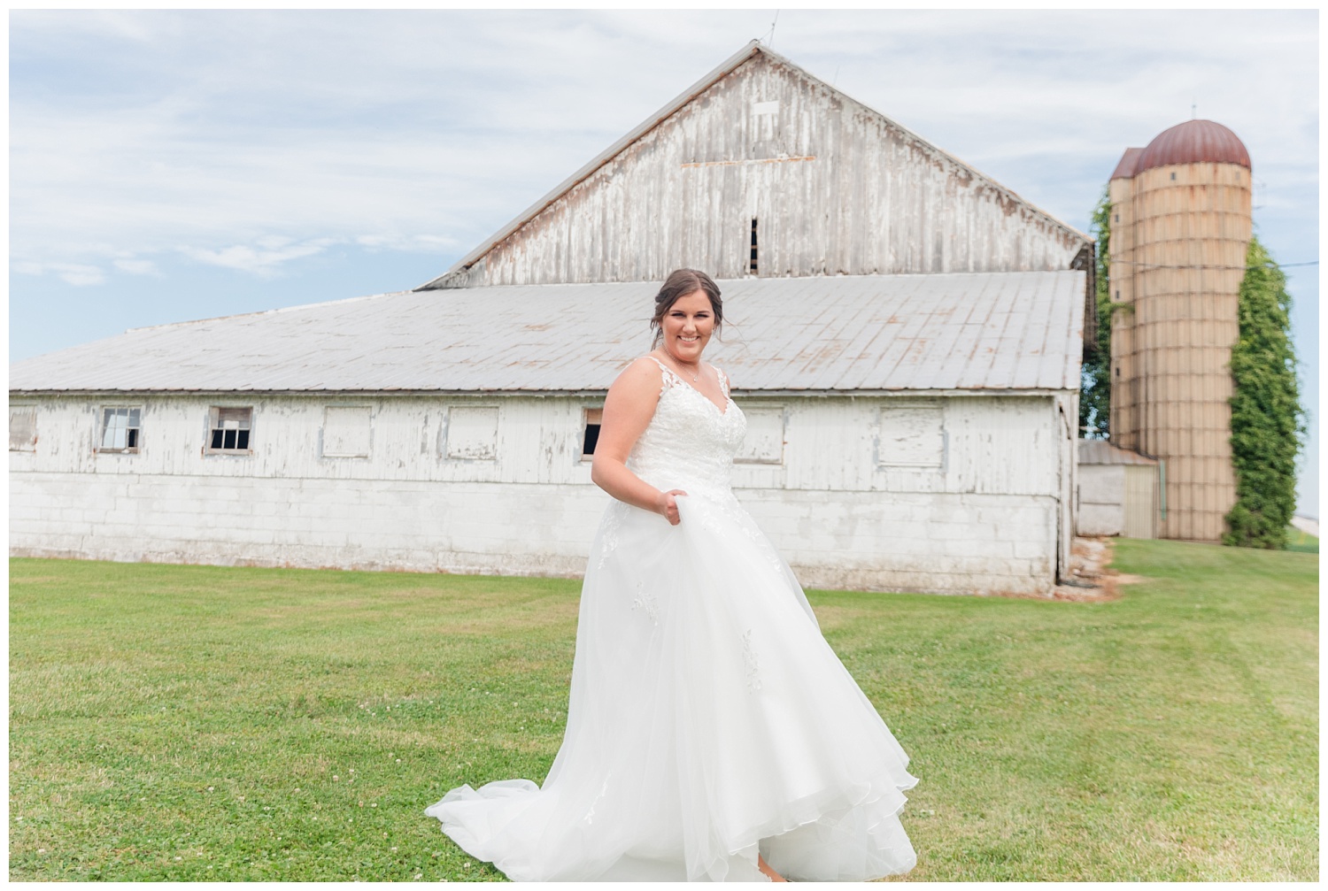 bride twirling in her dress at her farm in Fremont, Ohio