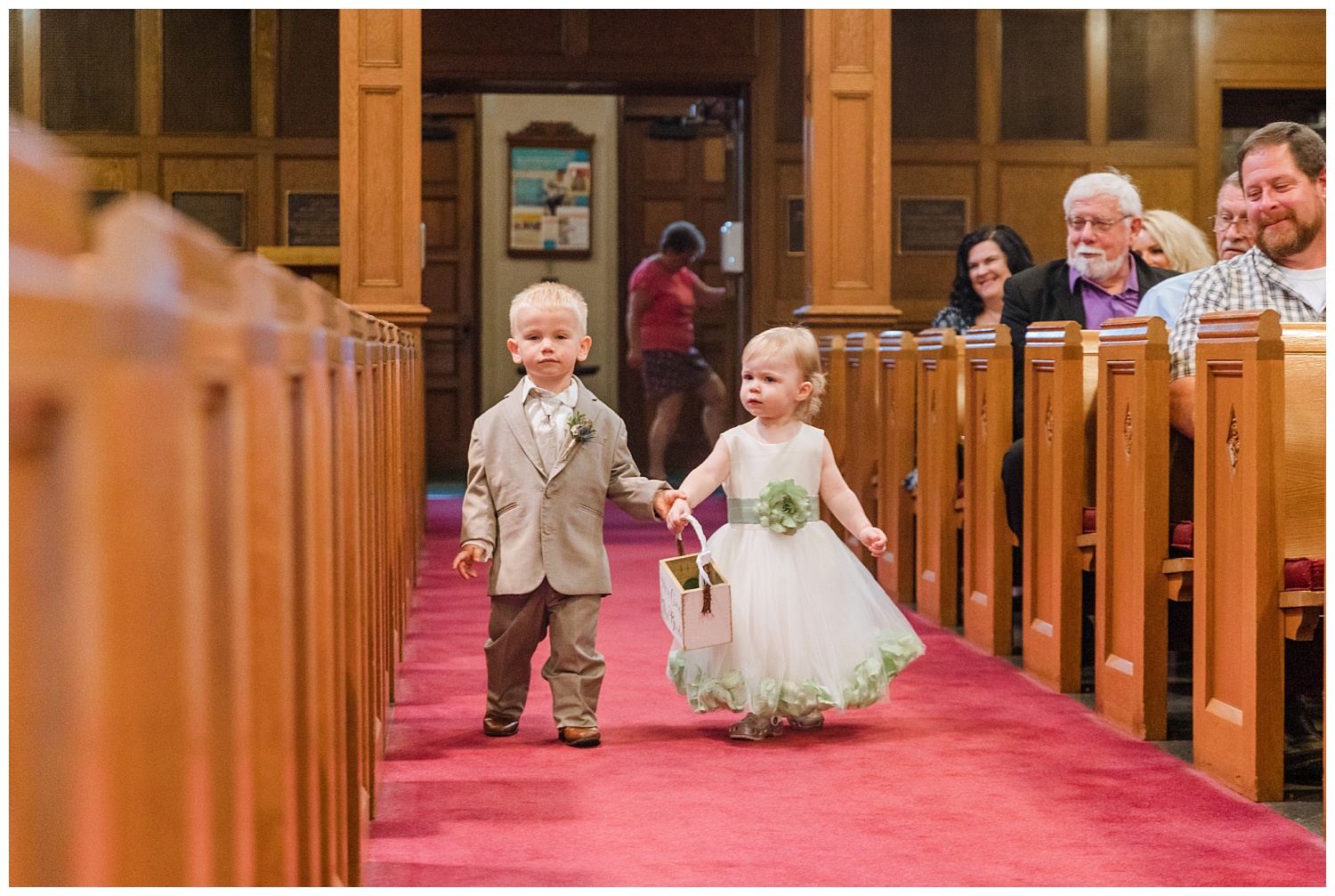 ring bearer and flower girl walking down the aisle at Grace Lutheran Church