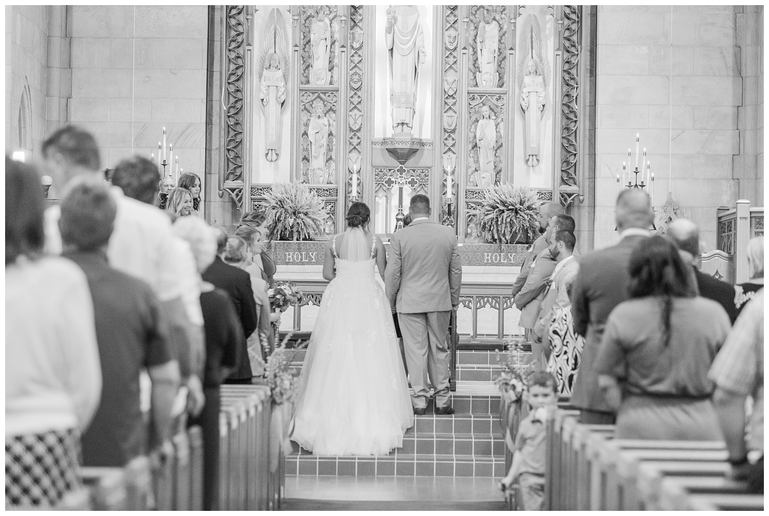 back of the bride and groom standing at the altar at Fremont, Ohio wedding