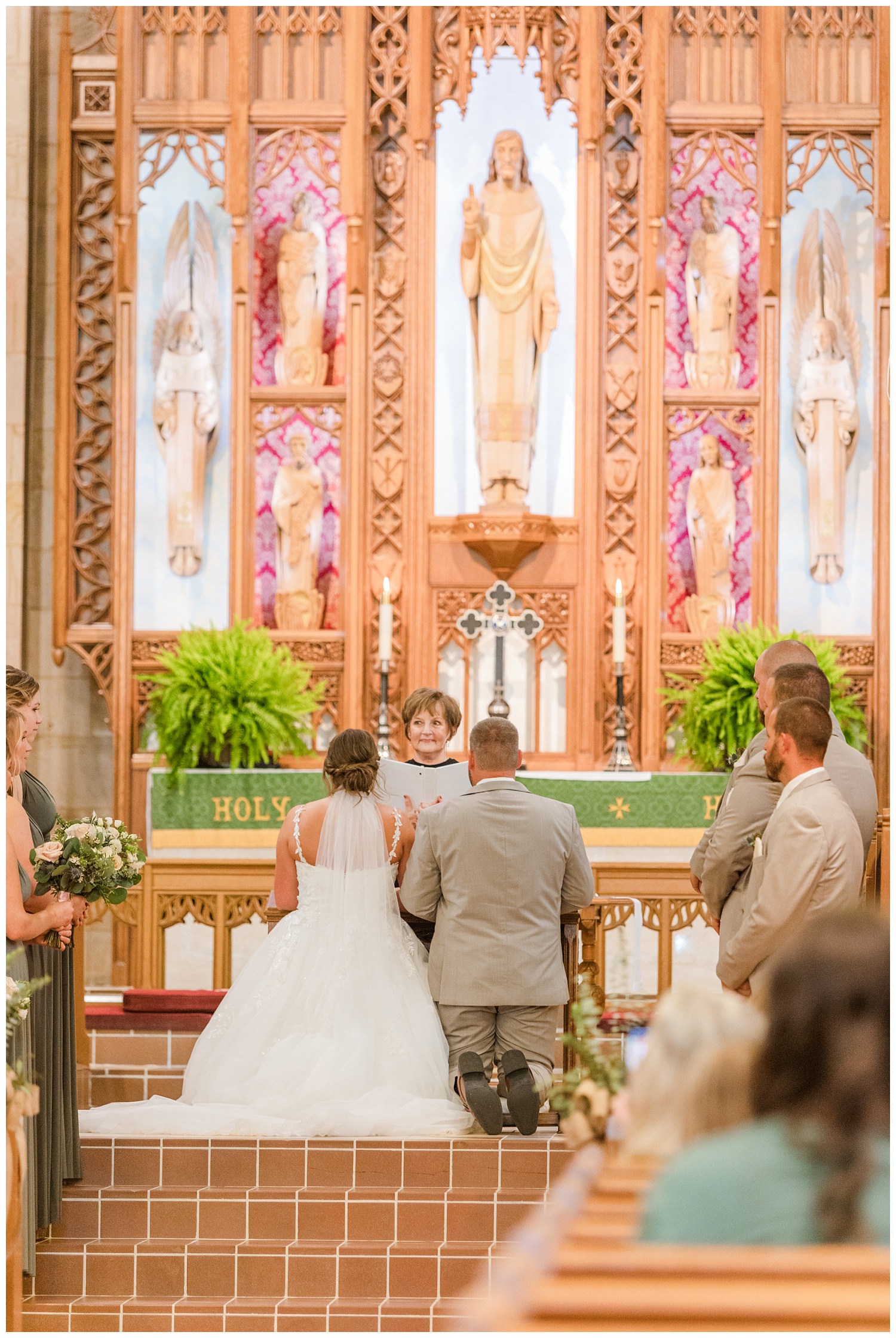 bride and groom kneeling at the altar at Grace Lutheran Church
