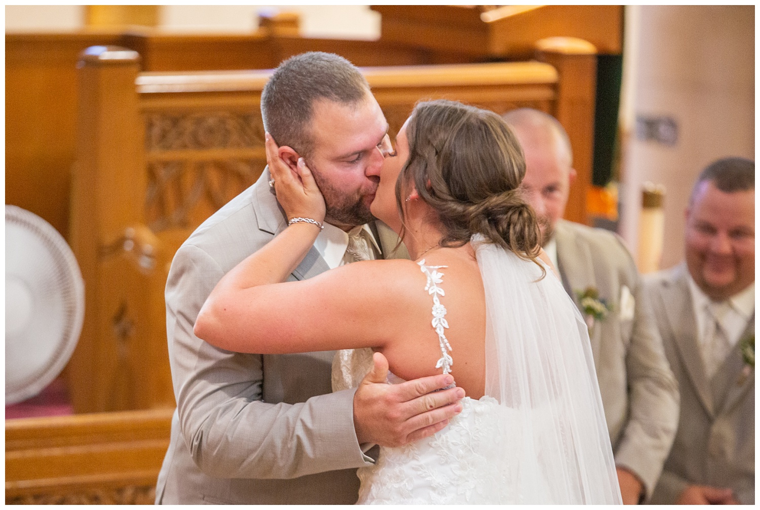 bride and groom kissing at wedding ceremony in Fremont, Ohio