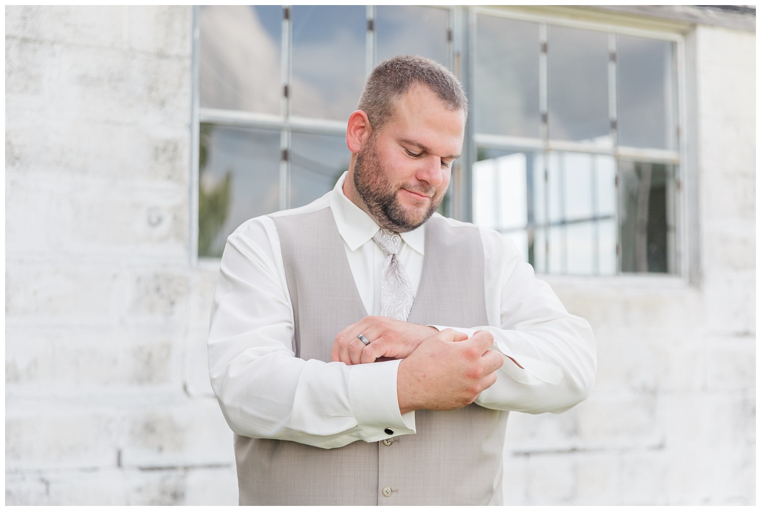 groom adjusting his cuff links at farm in Fremont, Ohio