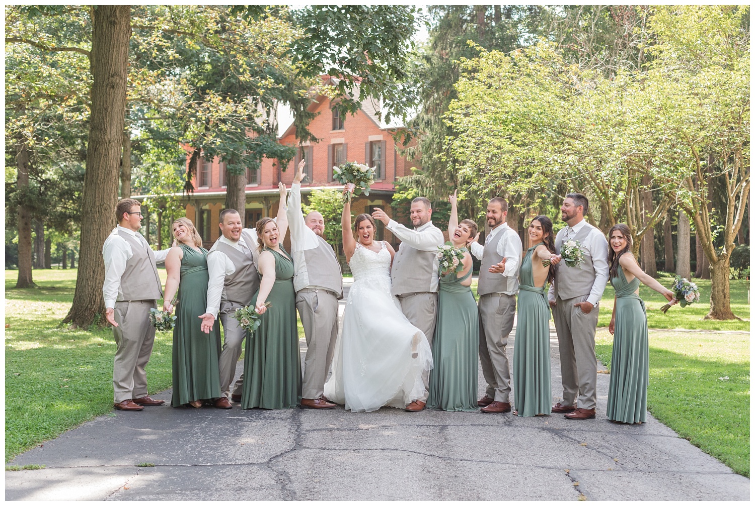 full bridal party posing at the Hayes Center in Fremont, Ohio