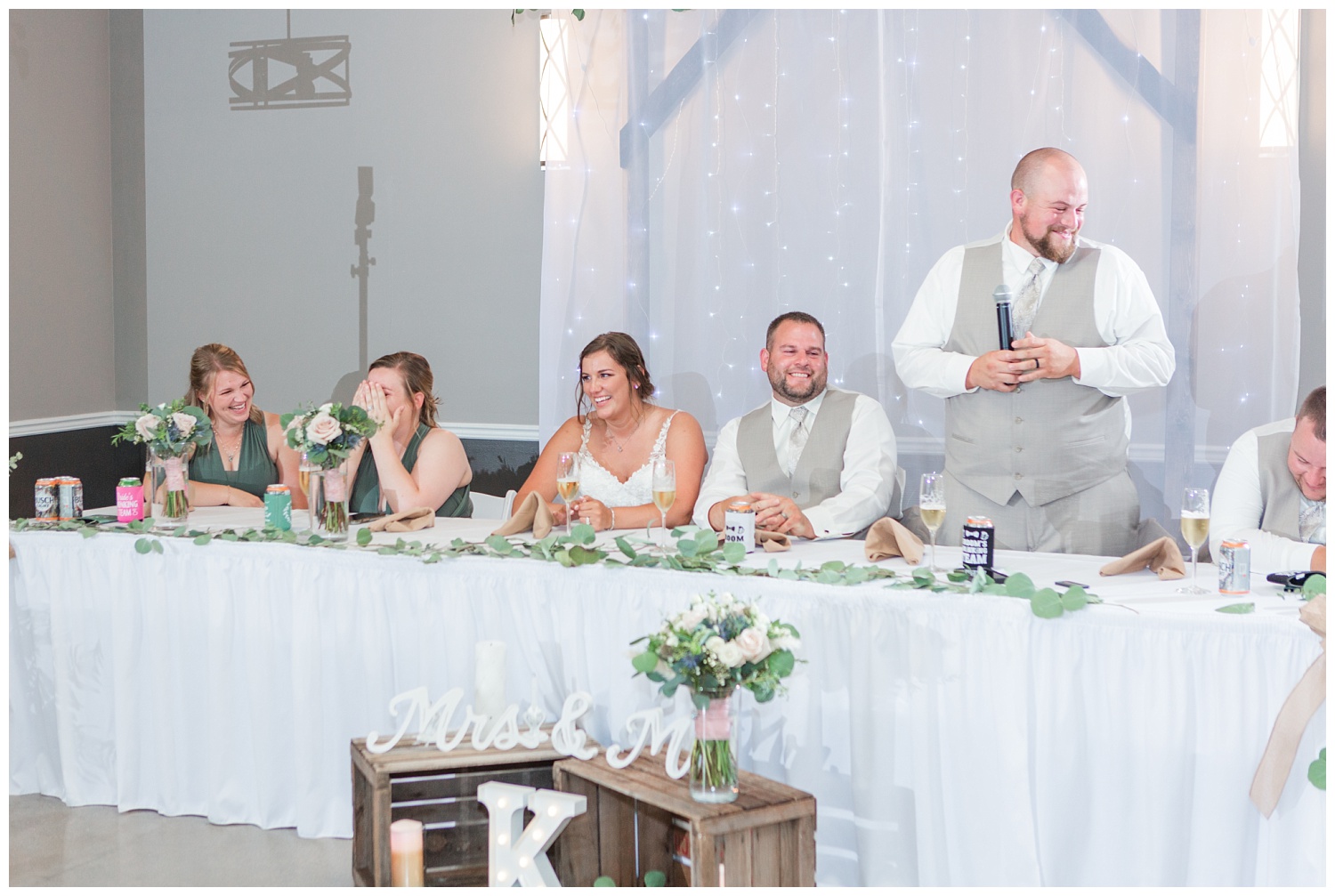 bridal party sitting at reception at Victors Event Center in Fremont, Ohio