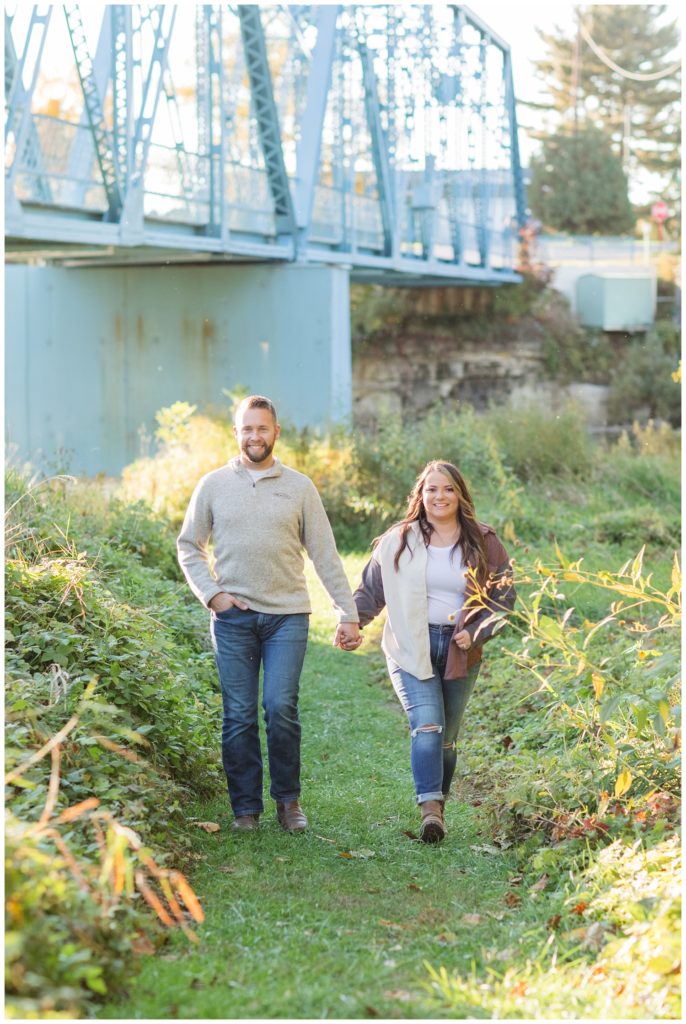 couple walking under the Tindall Bridge in Fremont, Ohio