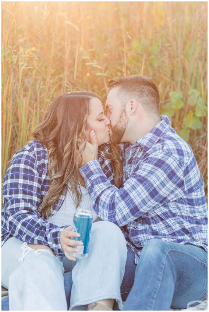 couple kissing and holding beers at Chudzinski Johannsen Park in Fremont, Ohio