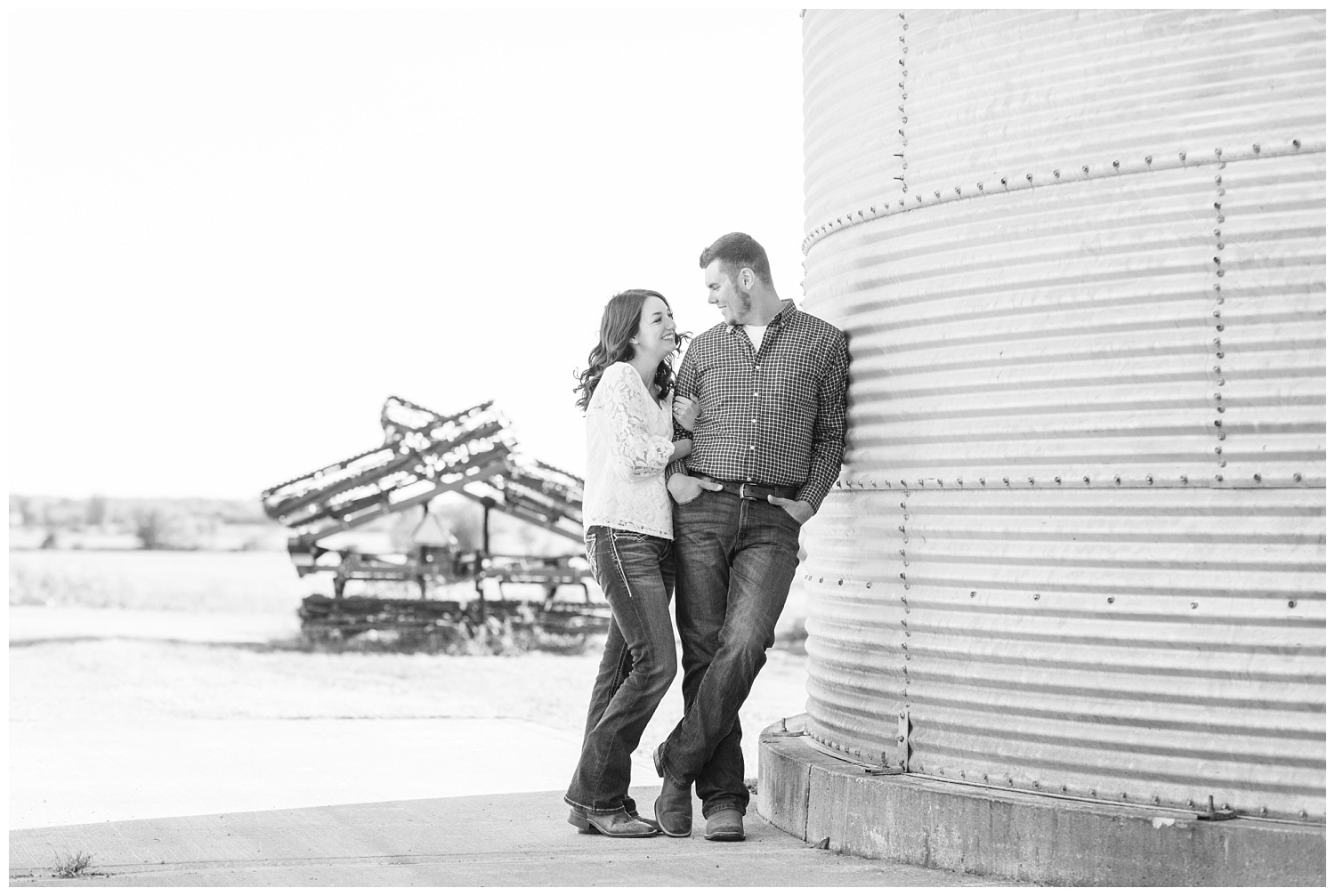 engaged couple standing next to a silo in Ohio