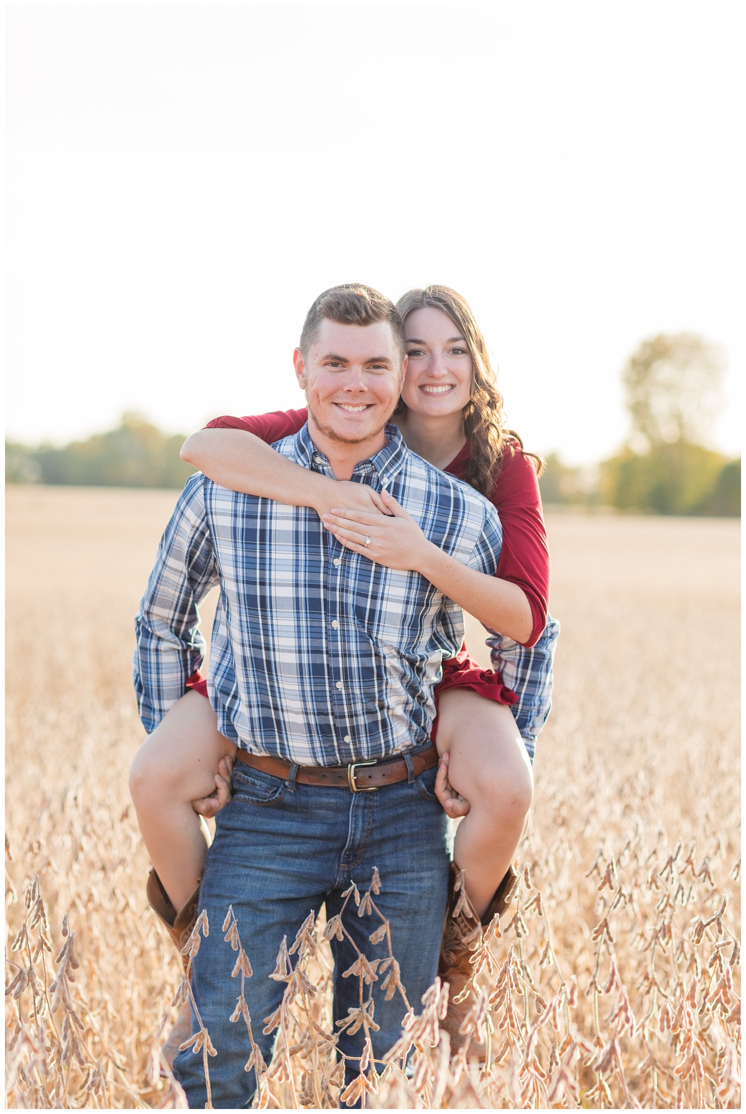 couple piggybacking in a corn field in northwest Ohio
