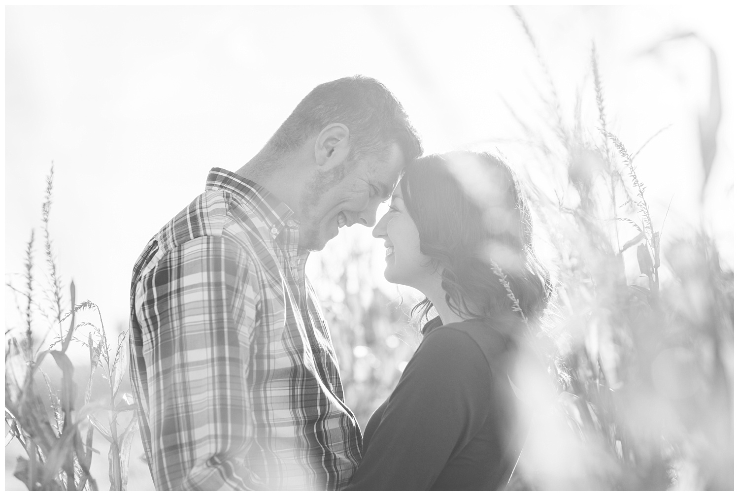 couple touching foreheads during engagement session in Ohio