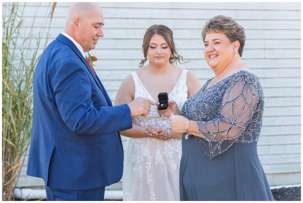bride giving her mom special jewelry before the ceremony