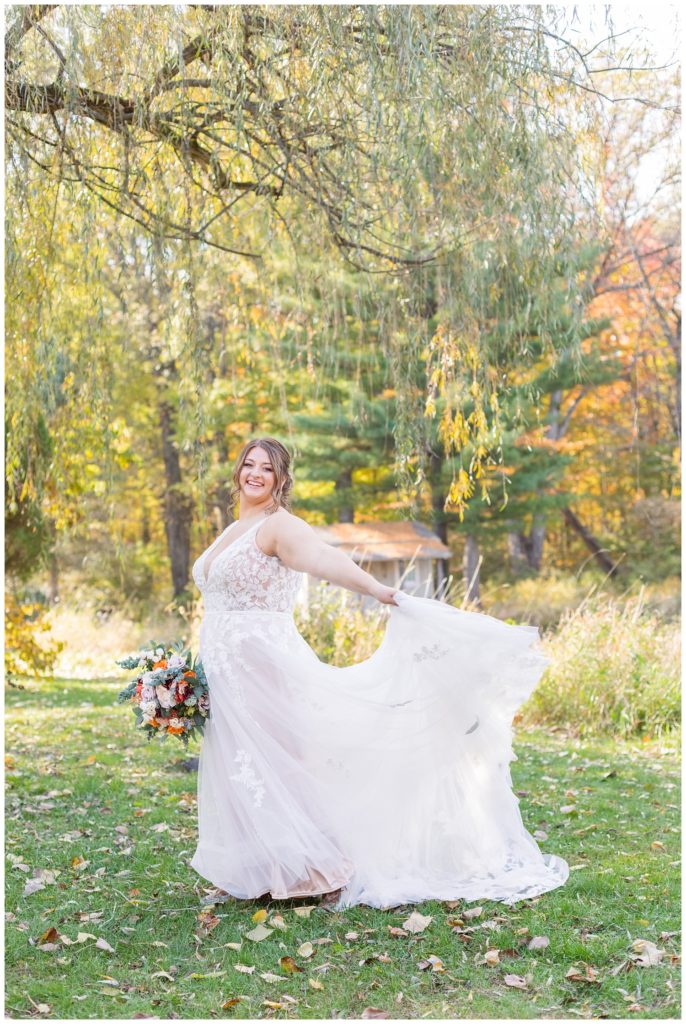 bride twirling with her dress and bouquet