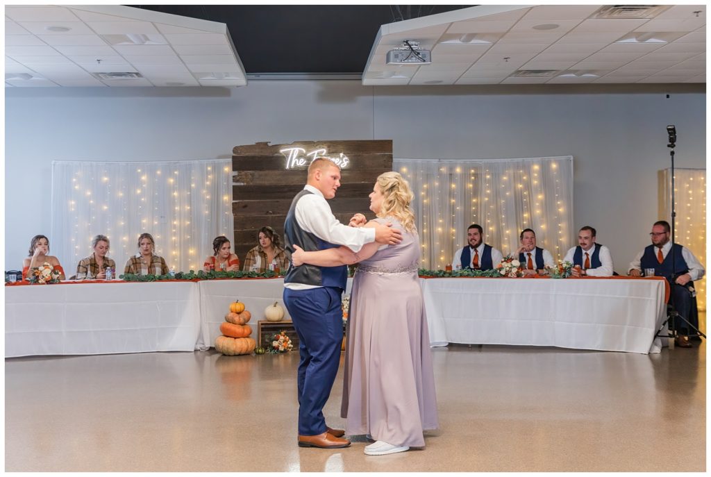 groom having dance with his mom at wedding reception