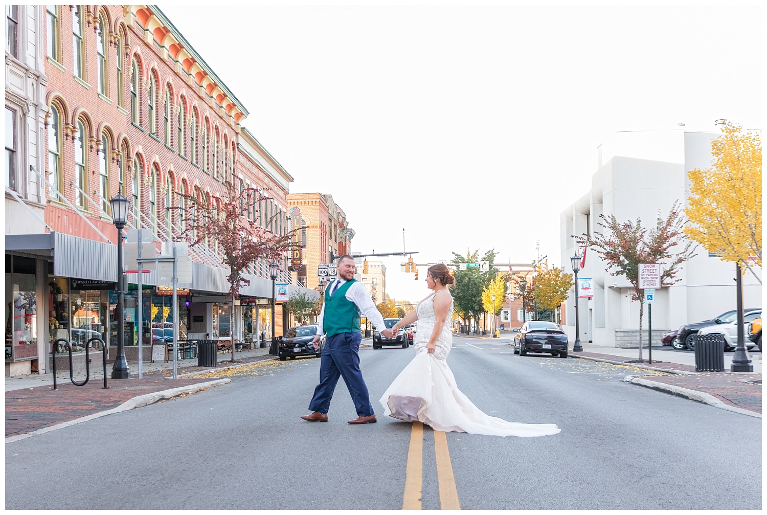 bride and groom walking across the street in downtown Gibsonburg