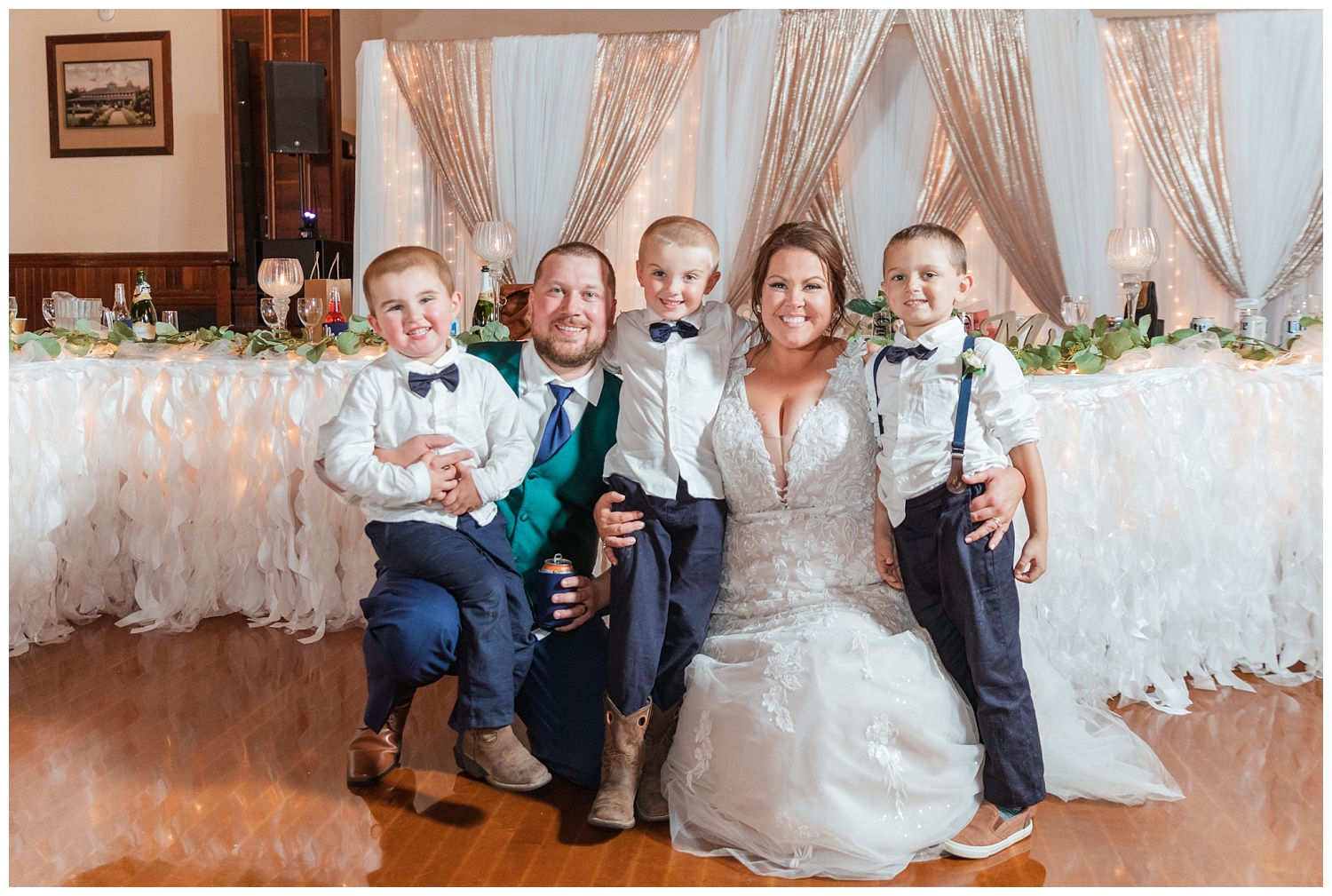 bride posing with groom and ring bearers at Bascom, Ohio reception