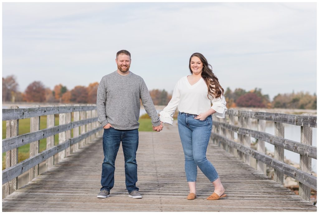 engaged couple standing on the bridge at Norwalk Reservoir in Ohio