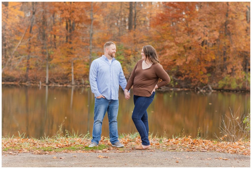 engagement session next to a pond and forest at Norwalk Reservoir