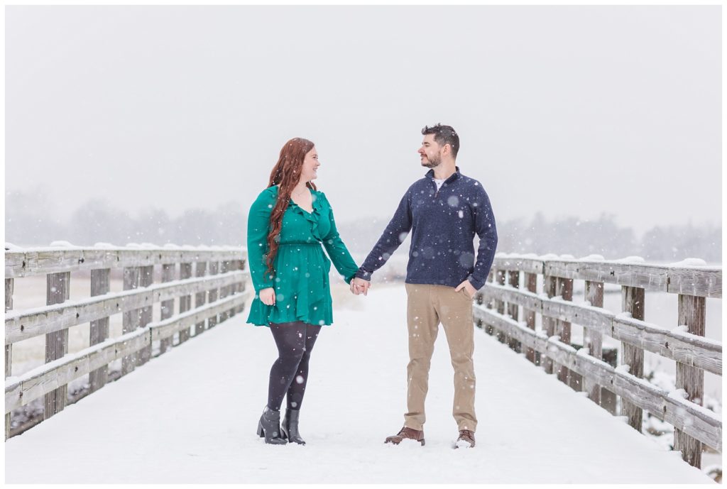 winter engagement session at Norwalk Reservoir bridge