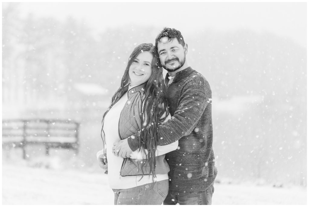 couple hugging in the snow at Norwalk, Ohio engagement session