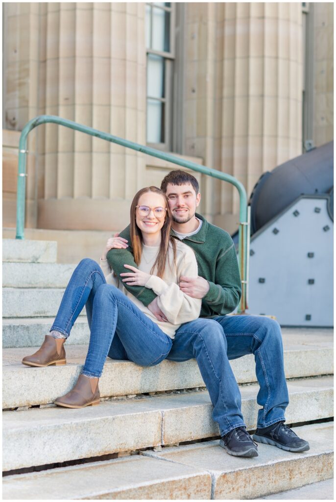 engaged couple posing for photos in downtown Tiffin, Ohio