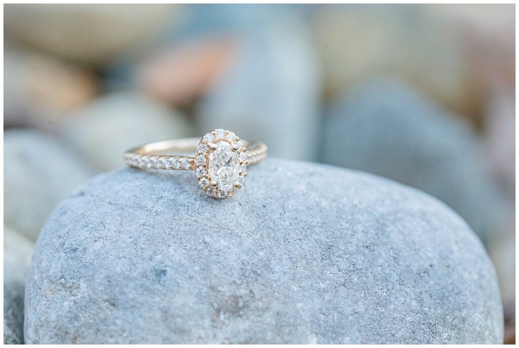 engagement ring sitting on a rock 